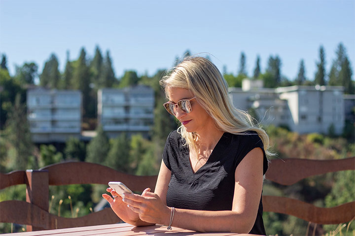 Woman using phone outdoors