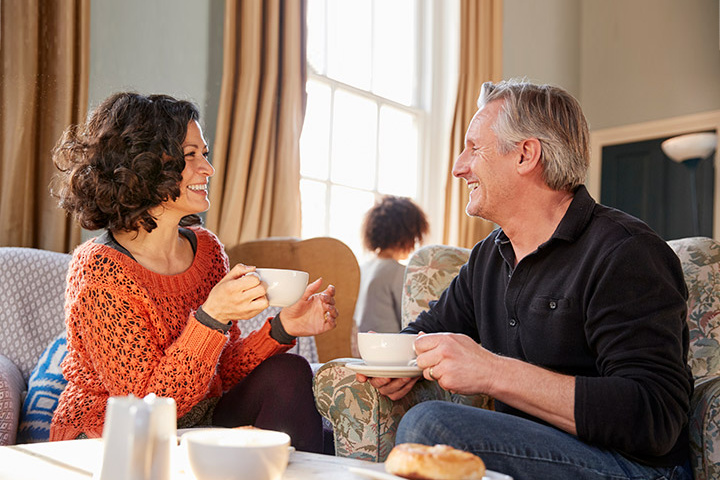 man and woman enjoying coffee