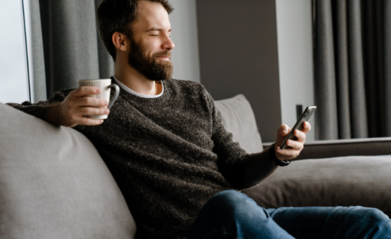 man looking at his cell phone