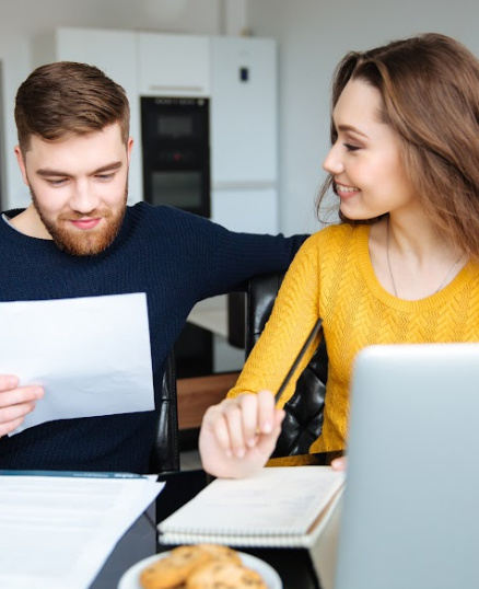 Man and woman looking at papers