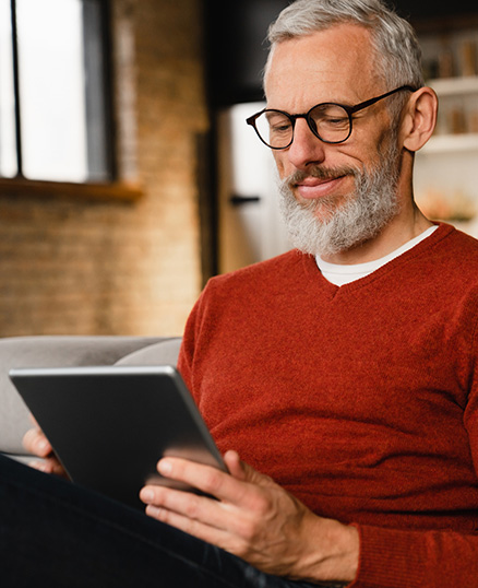 Man using tablet in living room