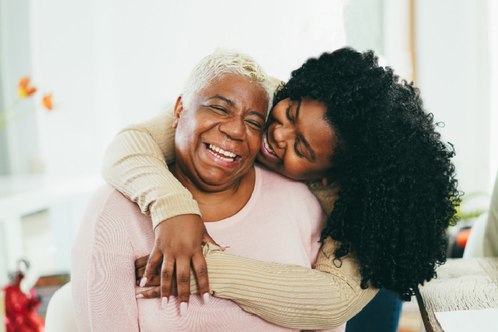 adult daughter hugging mom