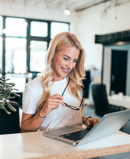 female business owner using laptop