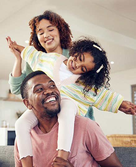 Young family playing in living room