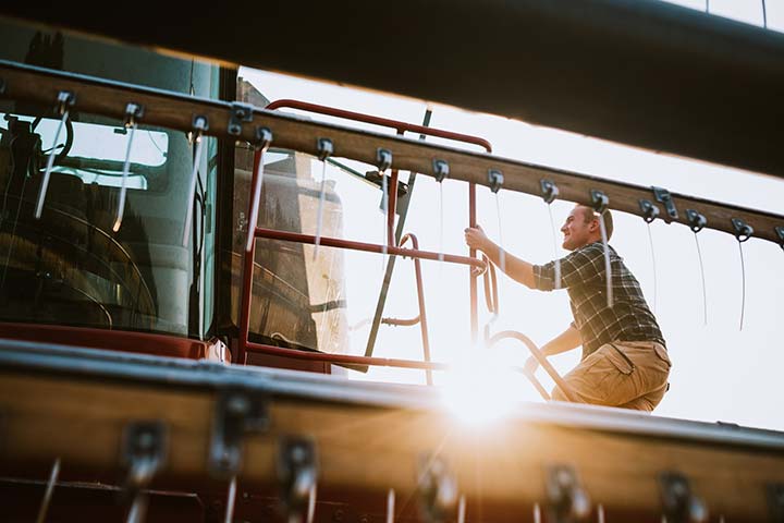 Man climbing in combine