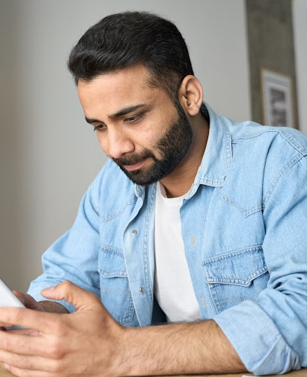 man looking at cell phone