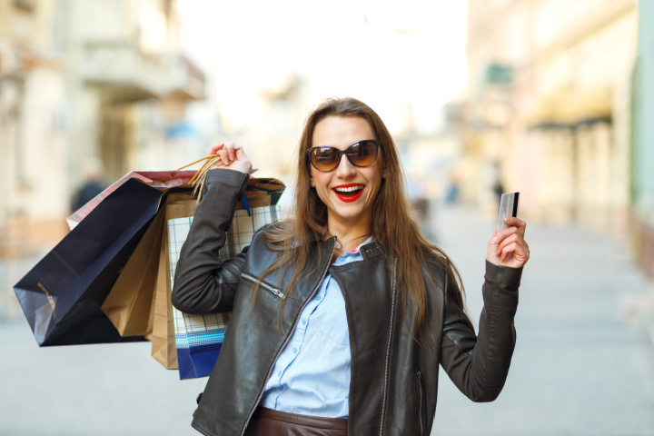 woman with shopping bags and gift card