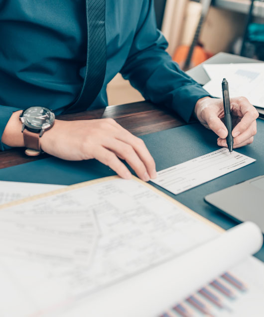 Close up of man writing check