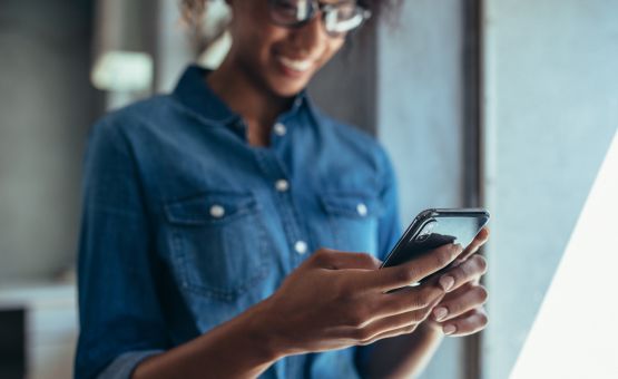 woman looking at cell phone