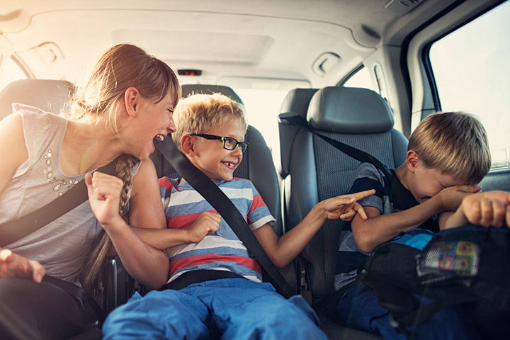 Young kids sitting in van