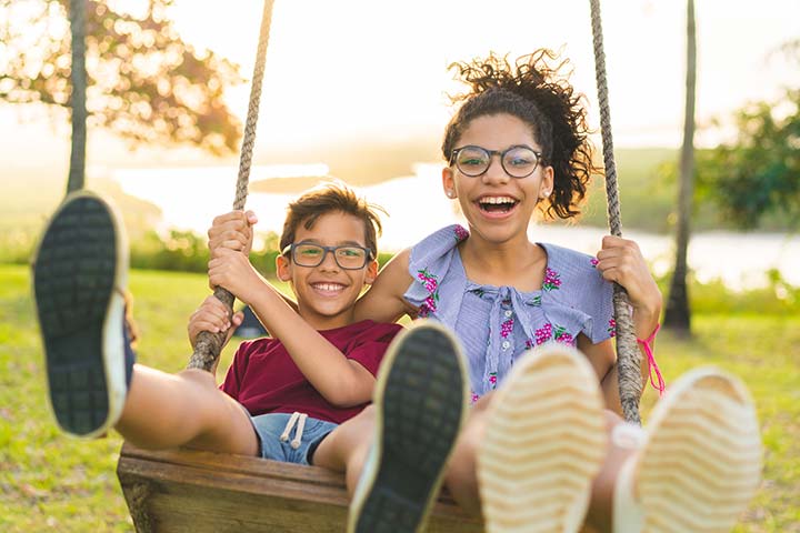 Two kids on one swing