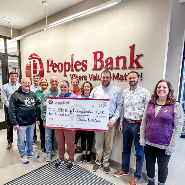 Peoples Bank and ATLAS employees with big Christmas For A Cause check