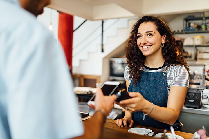 Female business owner working with customer