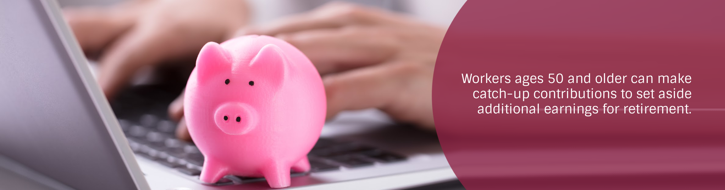 piggy bank sitting on laptop