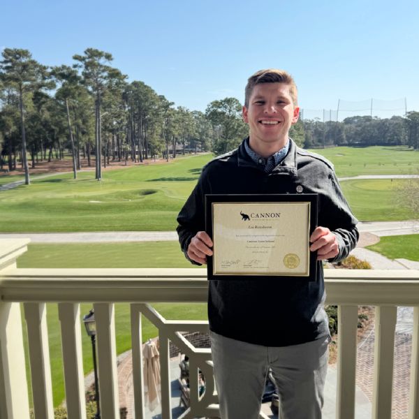 Lee Rozeboom with Cannon Trust School completion certificate