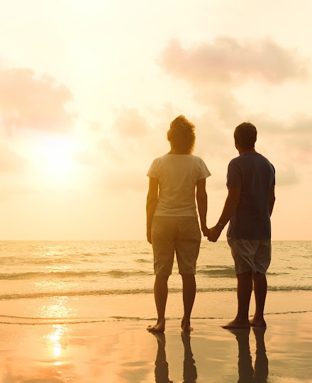 couple on a beach at sunset