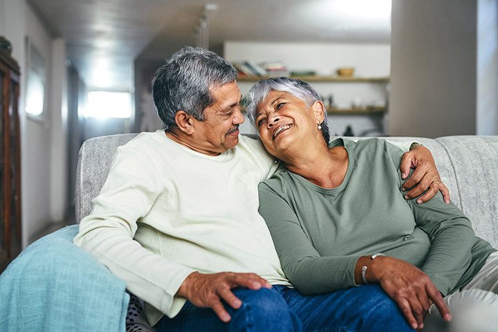 Couple hugging on couch